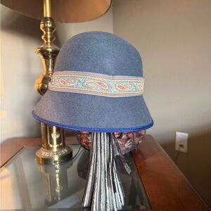 A "vintage-inspired" bucket or cloche design often seen in 1960s-1970s styles.